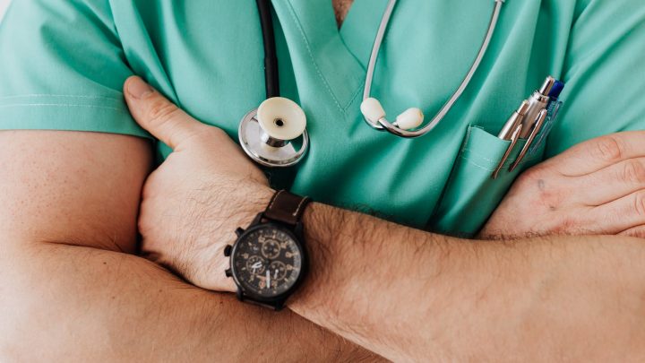 crop unrecognizable male doctor with stethoscope